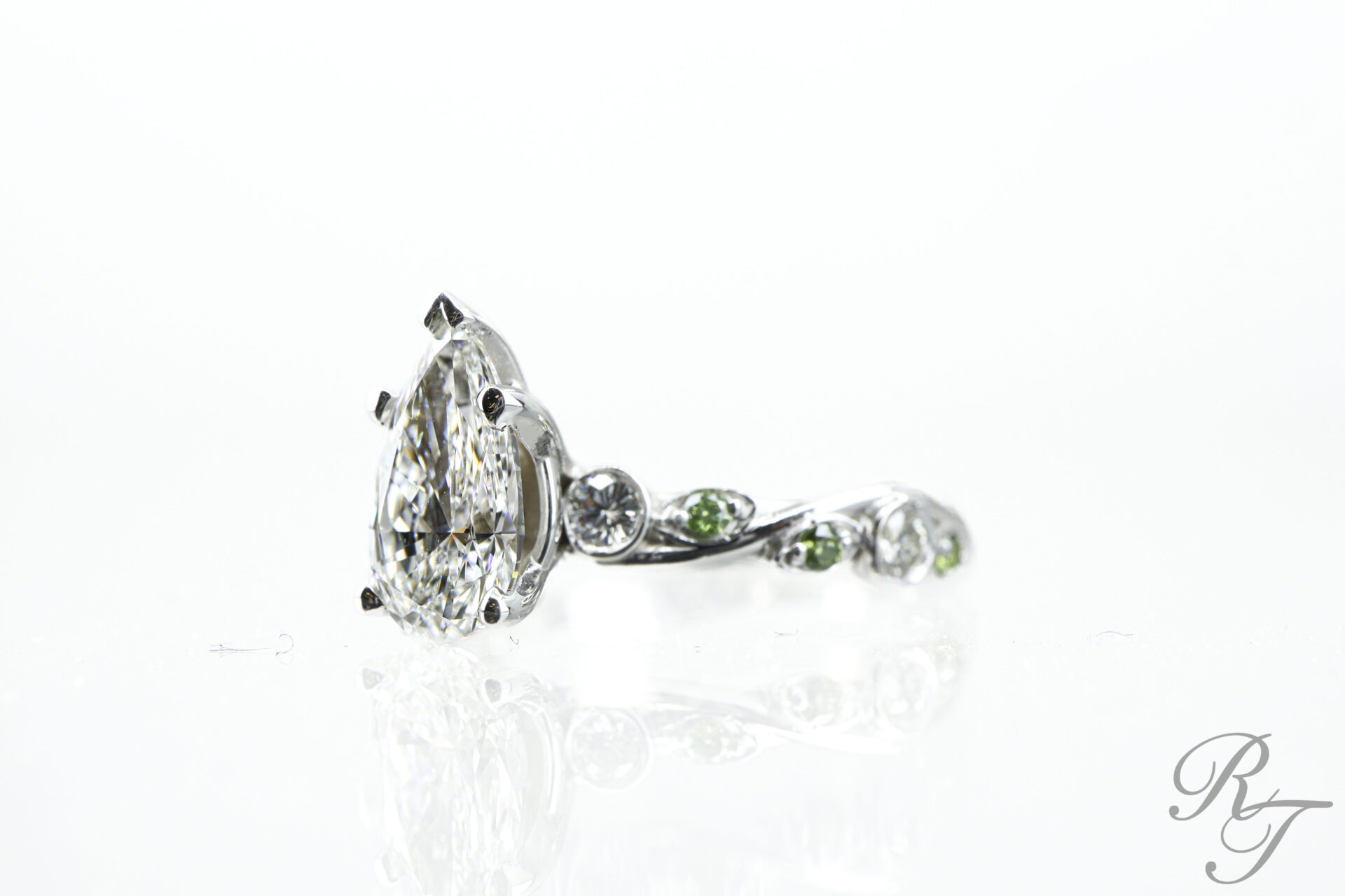 Intricate green and diamond ring perfect for bridal jewelry collections