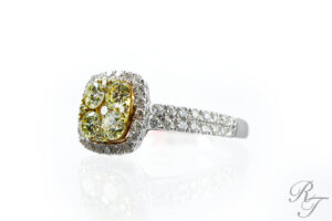 Yellow diamond engagement ring with a halo setting, demonstrating how warm-toned gemstones can complement various skin tones.