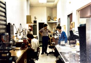 Throwback photo of the Rick Terry Jewelry Designs workshop from the late 1980s, featuring bench jewelers at work in Knoxville.