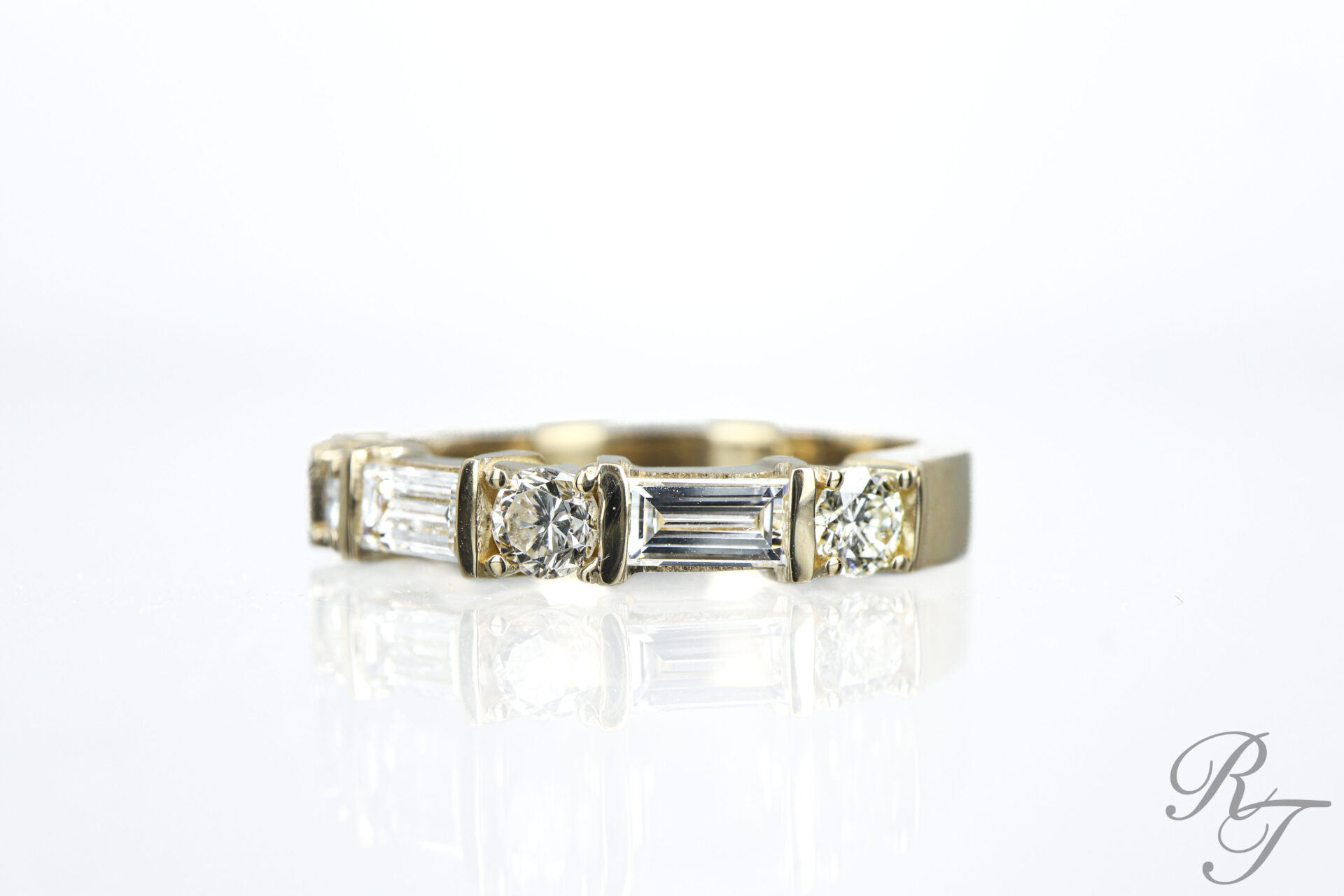 Custom wedding band with alternating baguette and round diamonds in yellow gold by Rick Terry Jewelry Knoxville