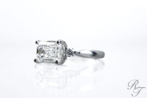 Custom engagement ring knoxville includes platinum emerald-cut diamond three-stone engagement ring, designed in Knoxville, TN by Rick Terry Jewelry Designs.
