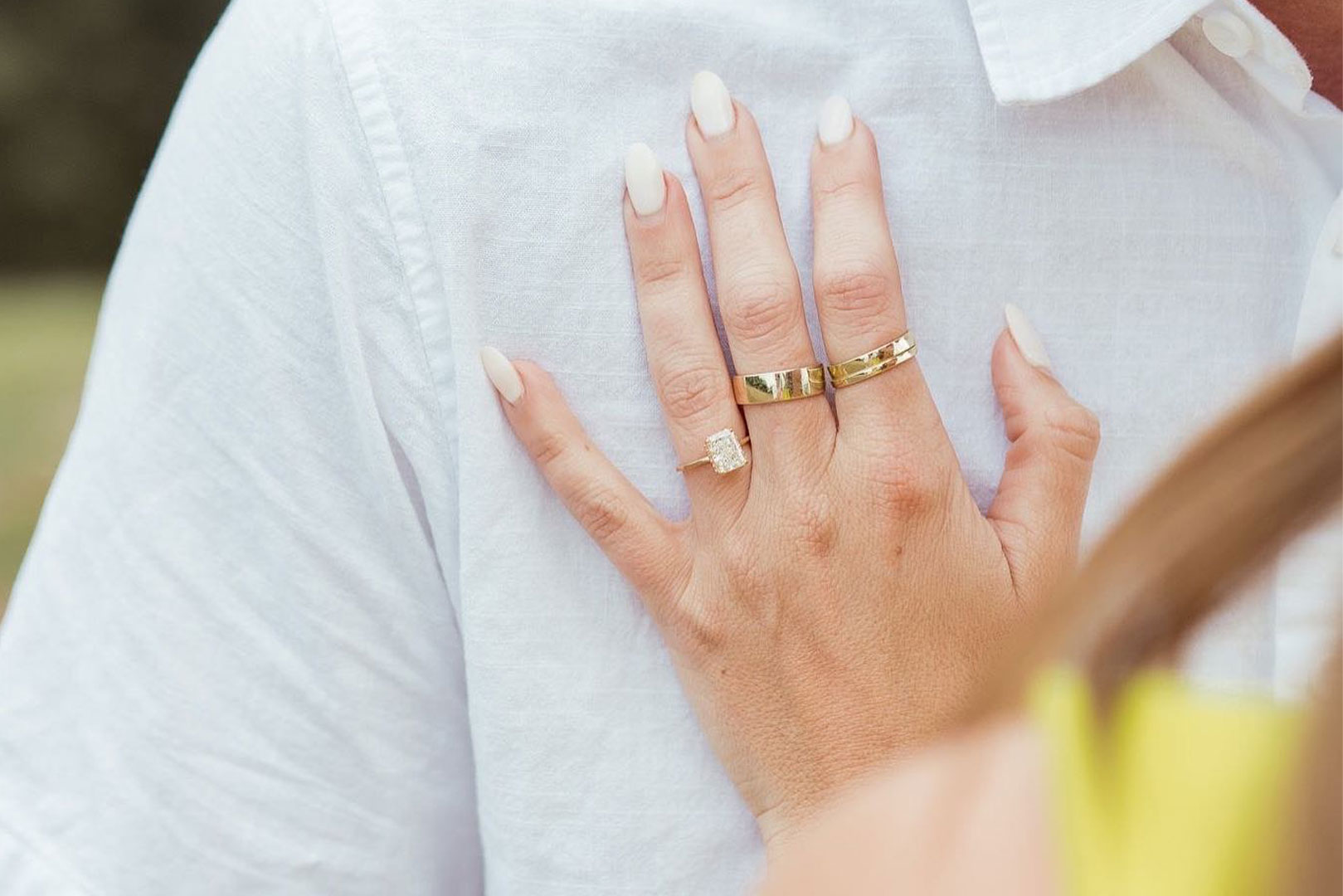 Bride wearing a custom gold wedding band paired with a diamond engagement ring from Rick Terry Jewelry in Knoxville