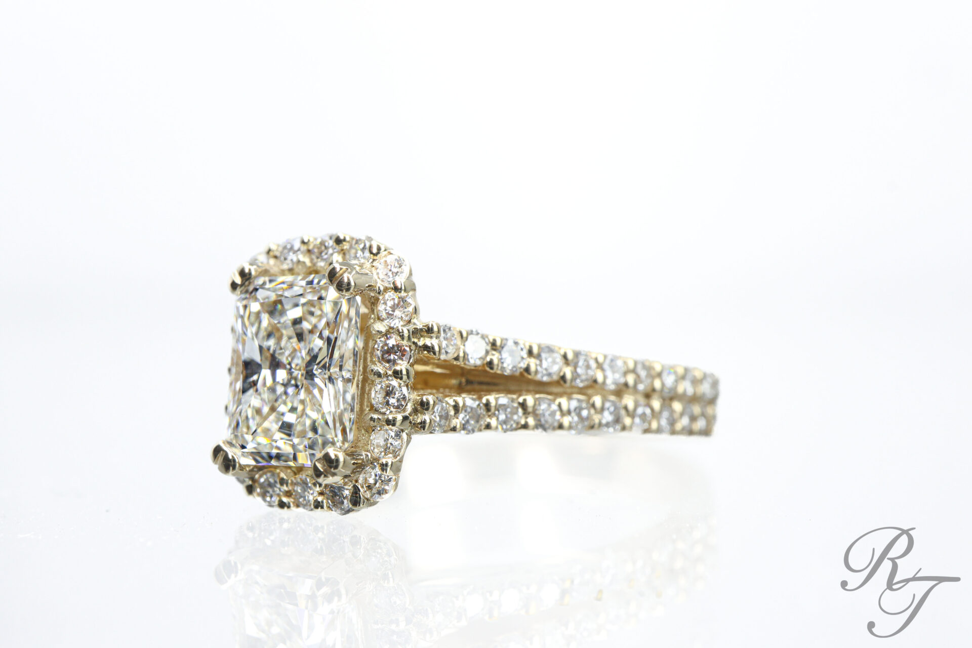 Custom yellow gold cushion-cut diamond halo engagement ring with pave split shank by Rick Terry Jewelry Designs Knoxville