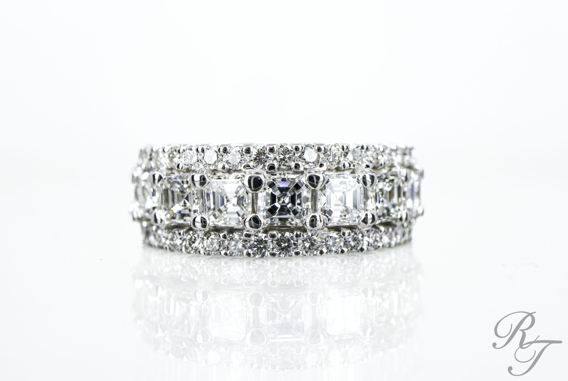 Custom diamond anniversary band with asscher-cut center row and round pave diamond rows crafted at Rick Terry Jewelry Designs Knoxville TN