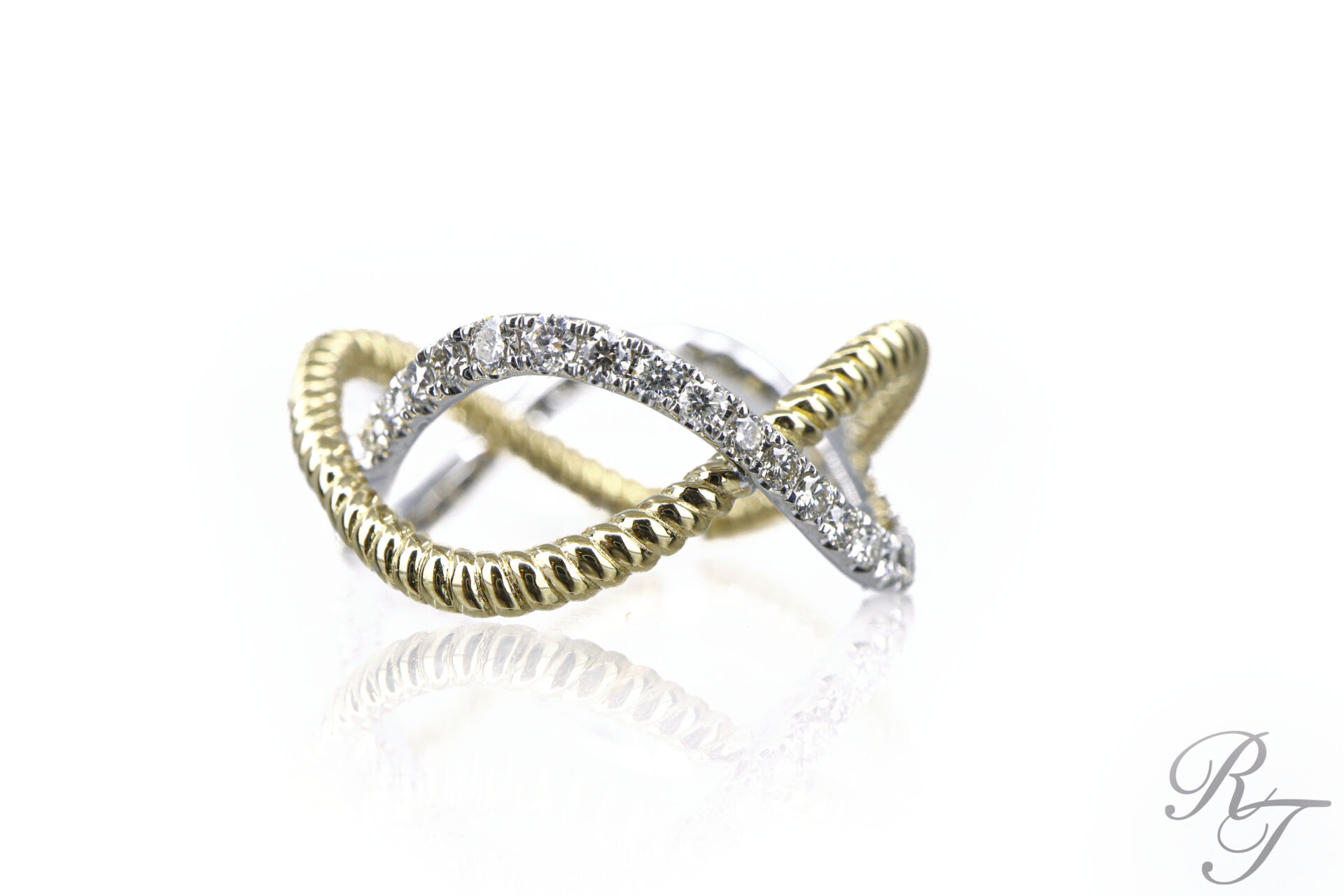 Custom two-tone crossover ring with yellow gold rope band and white gold diamond pave band by Rick Terry Jewelry in Knoxville
