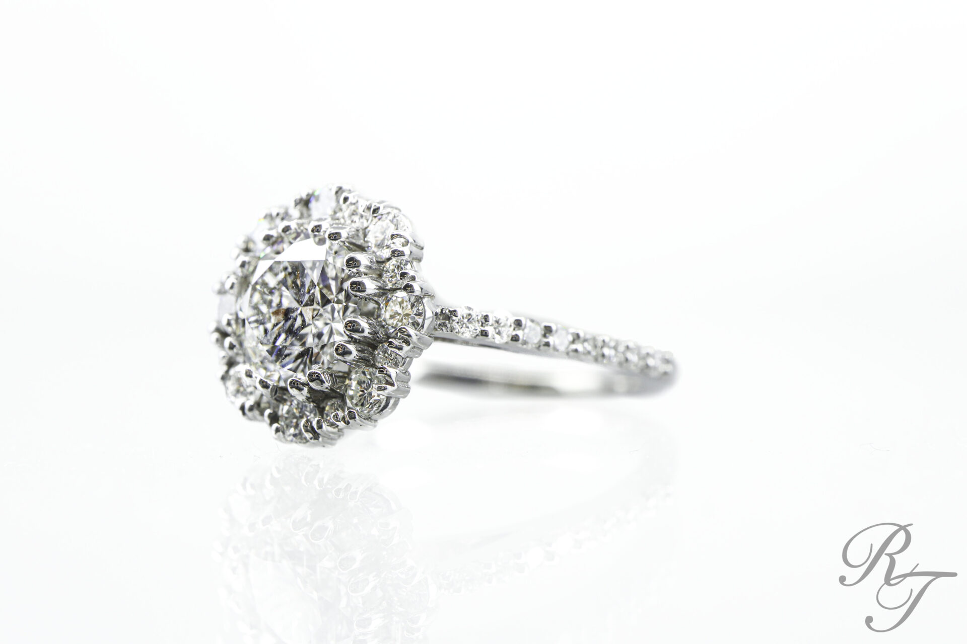 Engagement ring settings Knoxville custom round brilliant diamond halo with pave band handcrafted at Rick Terry Jewelry Designs